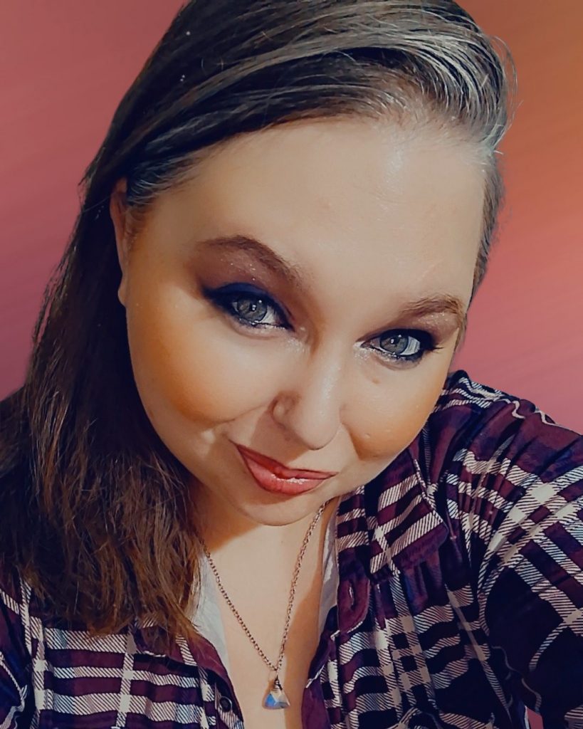 Wendi Kehn- Founder of Hellbloom Haven-Portrait of smiling woman with long hair